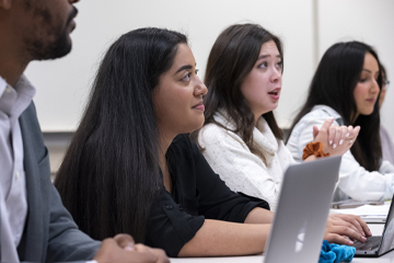 Row of School of Public Policy students in classroom listening to the faculty member teaching - Pepperdine University