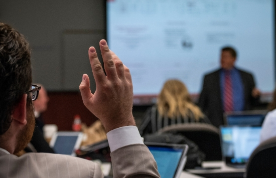 SPP student raising hand in class