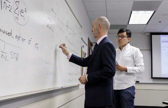 Dr. James Prieger teaching Aotian SPP Student