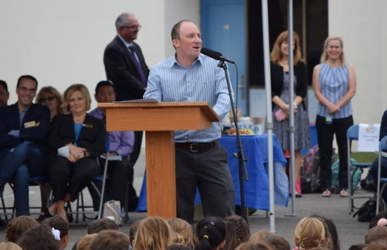 School of Public Policy Alum Jeremy Wolf at a podium