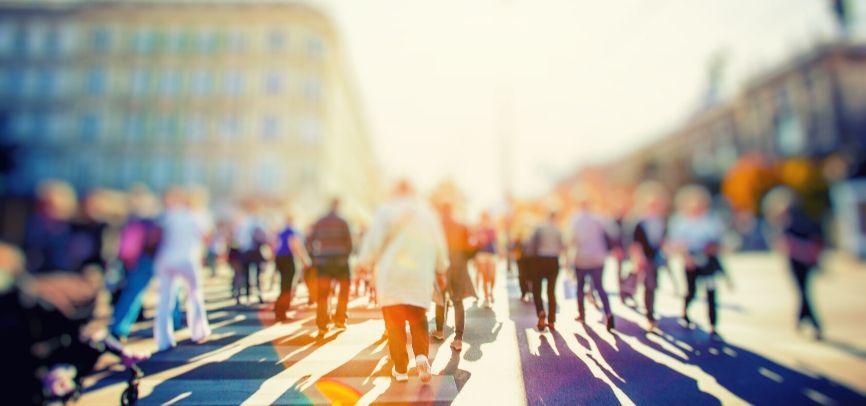 People walking across a crosswalk