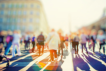 People walking across a crosswalk