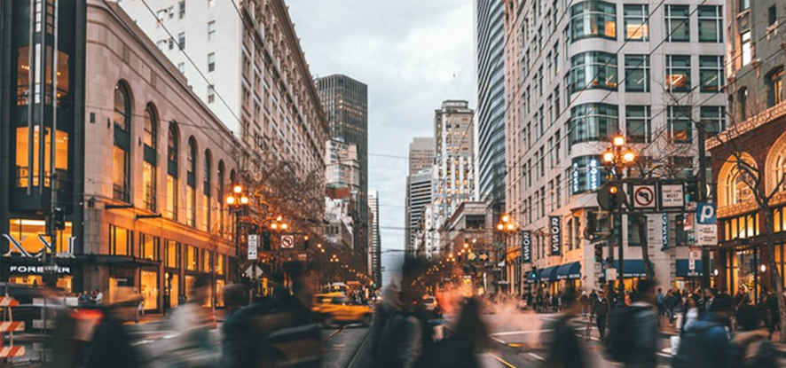 New York City with people walking across 