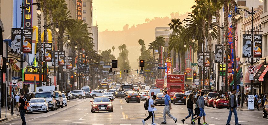 People walking across a crosswalk in Hollywood, California