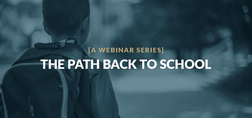 Little boy walking to school with a backpack on