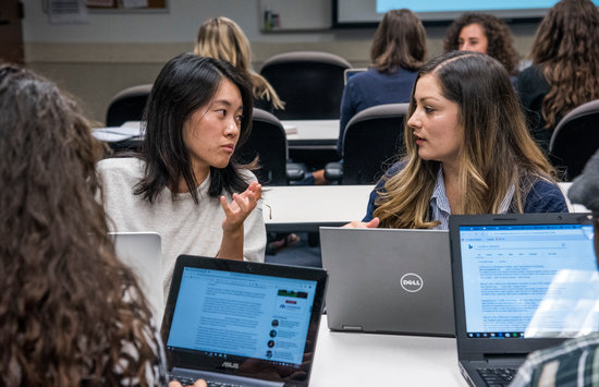 Students talking together in a class