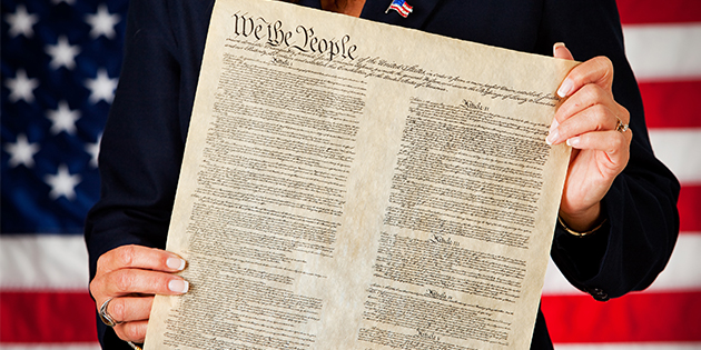 Woman holding the Constitution 