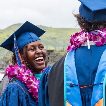 A graduate laughing