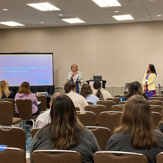 Maureen Tobin speaking to a room on engaging communities in-person