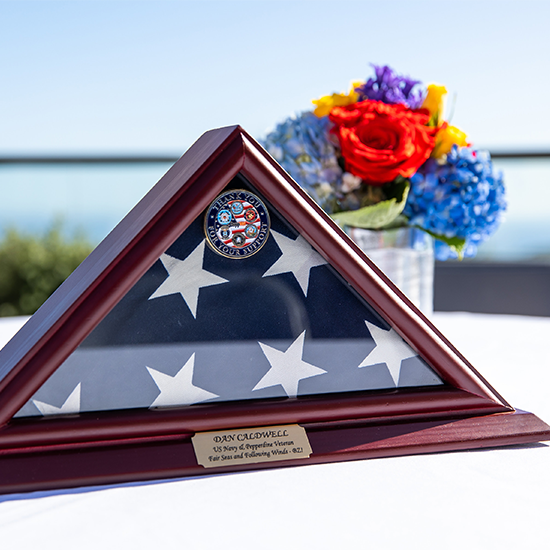 folded flag and flowers