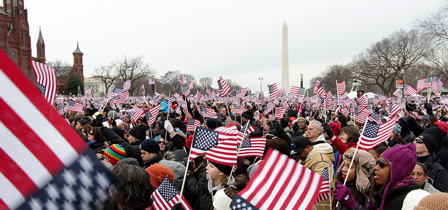 People in a crowd with American flags
