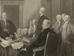 America's founding fathers sitting at a desk