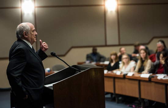 James Wilburn speaking at podium at event