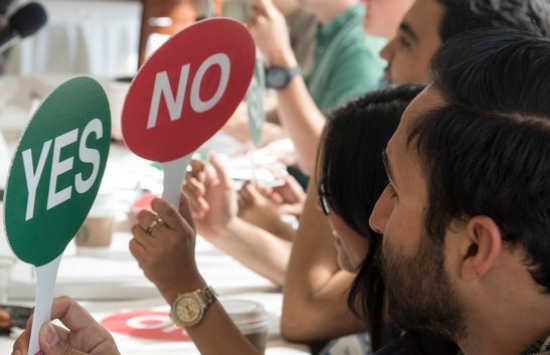 Students Holding Up Yes and No Paddles